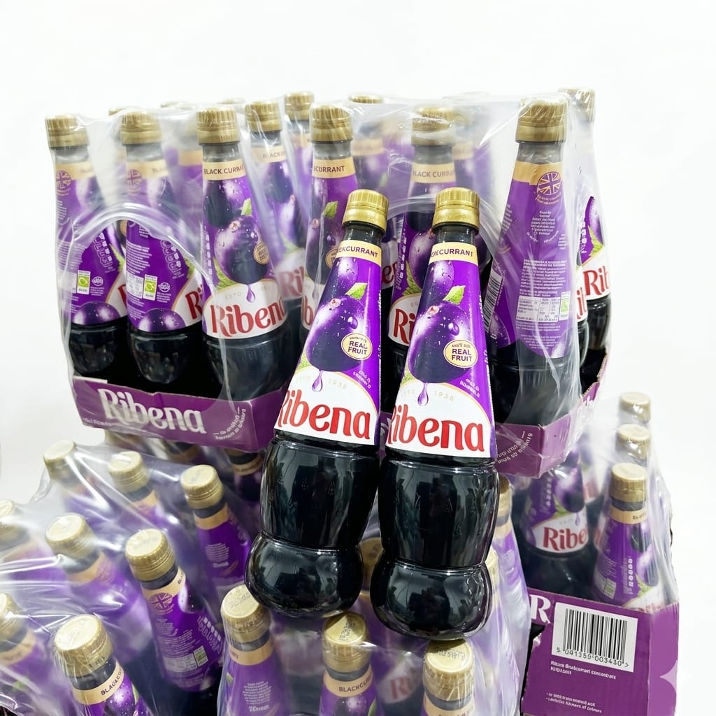 Ribena Bring home the unmistakable, rich taste of the UK's favorite blackcurrant drink. Made with 100% British-grown blackcurrants, Ribena Blackcurrant Juice Cordial delivers a deliciously fruity burst that has been loved by generations. Perfect for family sharing, this 850ml bottle goes a long way. Just dilute it with water to create a refreshing drink that is both deeply satisfying and a fantastic source of your daily Vitamin C. Blackcurrant Juice Cordial 850ml | Buy Online Ribena Blackcurrant Juice Cordial 850ml plastic bottle with iconic purple branding, showcasing real blackcurrants on the label.β